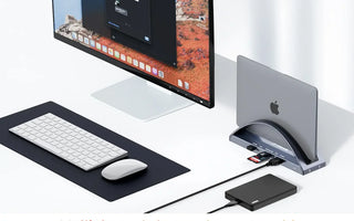 MacBook Pro docking station connecting multiple peripherals for a dual monitor workspace
